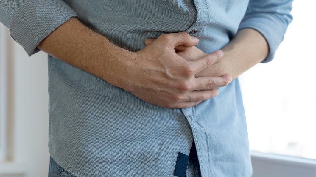 Patient holding his stomach