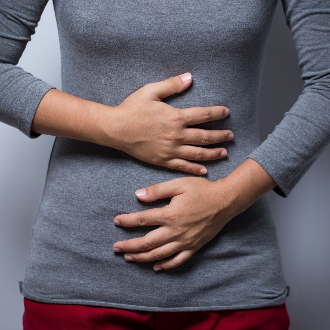 Patient (female) holding digestive system